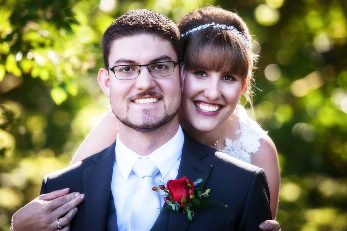 Seattle wedding photographer Tom Ellis Photography. Close up photo of smiling bride and groom during their wedding celebration at French Creek Manor in Snohomish WA