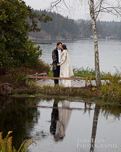 Reflection of couple kissing on beach at Kiana Lodge