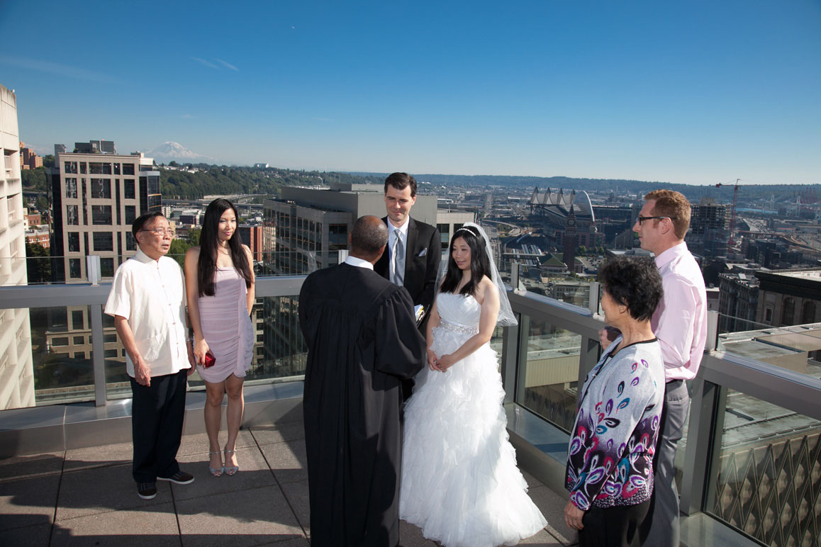 Seattle wedding photographer Tom Ellis Photography. Seattle municipal courthouse rooftop wedding, with scenic view of Seattle and Mt Rainier