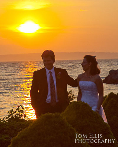 Bride and groom at sunset at Shilshole Bay Beach Club in Seattle