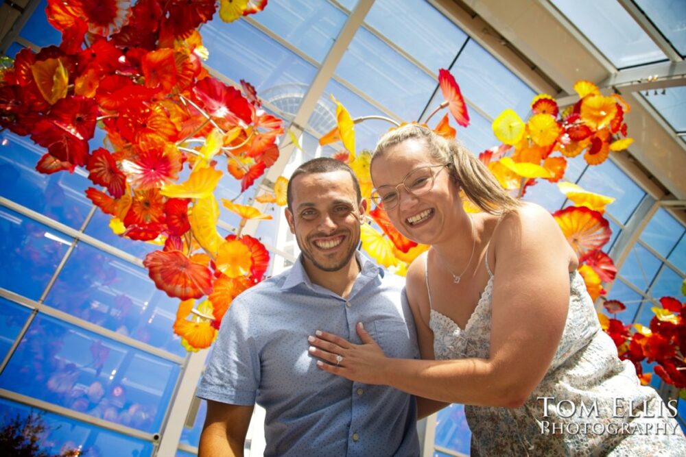 Ryan proposed to Ashley at the Chihuly Garden and Glass in Seattle. Tom Ellis Photography, Seattle proposal and engagement photographer