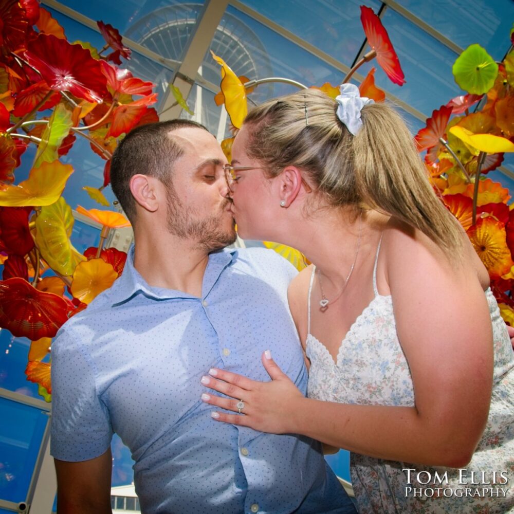 Ryan proposed to Ashley at the Chihuly Garden and Glass in Seattle. Tom Ellis Photography, Seattle proposal and engagement photographer