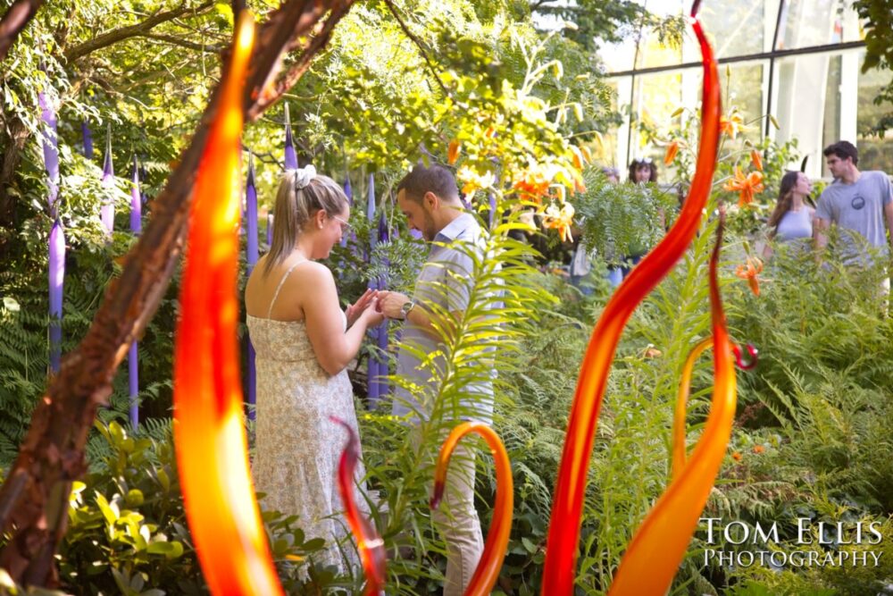 Ryan proposed to Ashley at the Chihuly Garden and Glass in Seattle. Tom Ellis Photography, Seattle proposal and engagement photographer