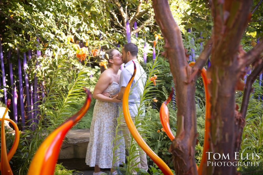 Ryan proposed to Ashley at the Chihuly Garden and Glass in Seattle. Tom Ellis Photography, Seattle proposal and engagement photographer